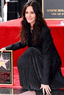 Courteney Cox turns Monica Geller as she cleans Hollywood Walk of Fame star